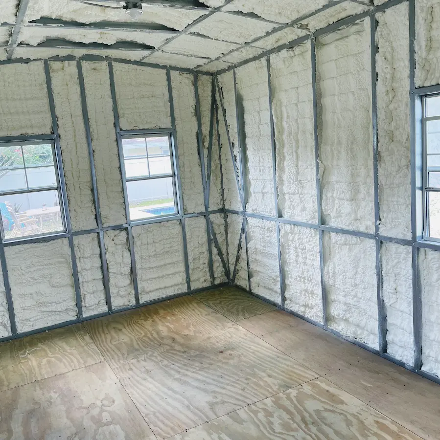Closed-cell spray foam insulation applied to wall cavities in a residential project in Tecumseh